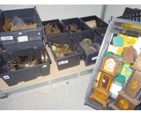 A quantity of clock movements, electric movements, a quantity of clock glasses and bezels, a box of mainsprings, two 'miniatu