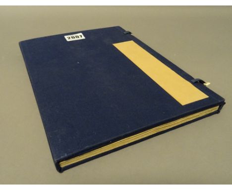 A Japanese Noh play manuscript, Edo period, approx. 100 pages of black script on paper, limp hand painted covers within blue 