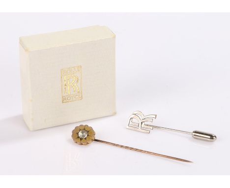 Stick pins, to include a Rolls Royce example and yellow metal example, (2)