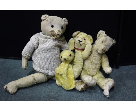 Three late 19th/early 20th century teddy bears, sooty puppet (4)