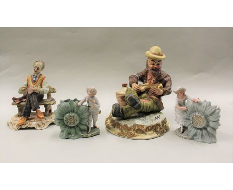 Capodimonte figure, of a man seated playing an instrument, together with another of a seated man and two vases, (4)