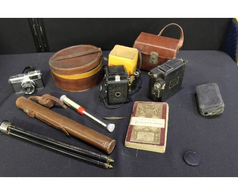 Objects, to include camera, tripod, hydrometer, Campro cine camera, etc