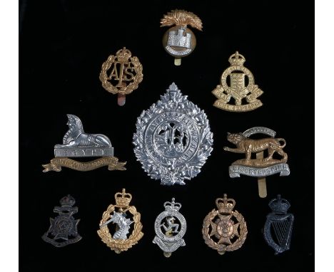 British Army cap badges from different periods, the Leicestershire Regiment, the Argyll and Sutherland Highlanders, Auxiliary
