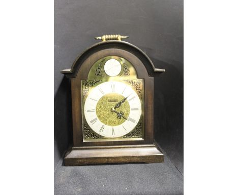 Mauthe Germany mahogany cased mantel clock, the arched brass dial with silvered chapter ring and Roman numerals, the case wit
