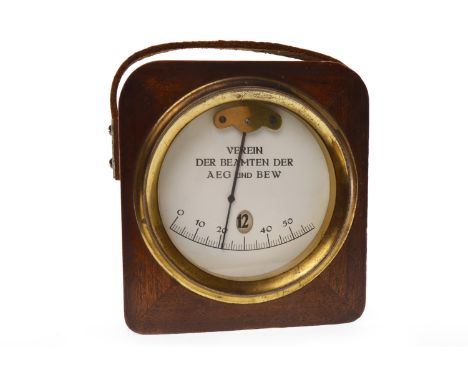RARE EARLY 20TH CENTURY GERMAN TRAVELLING TIMEPIECEthe white enamel dial with six ten minute markers and central hour apertur