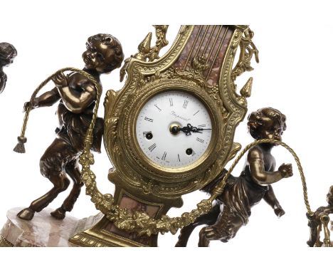 ITALIAN GILT METAL AND MARBLE CLOCK GARNITUREof 18th Century French design, the movement by Franz Hemle numbered 130-070, the