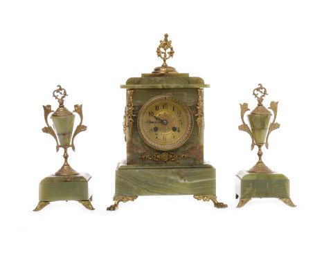 VICTORIAN ONYX AND GILT METAL CLOCK GARNITUREthe eight day movement by Japy Freres et Cie. numbered 13245 48, the circular br