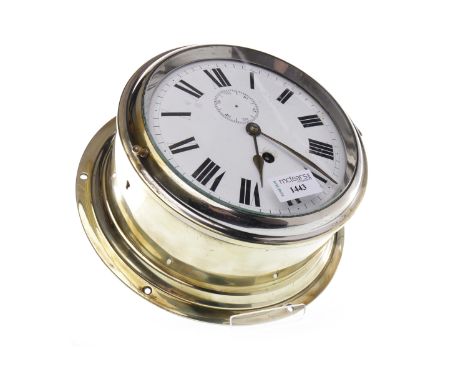 SHIP'S BRASS BULKHEAD CLOCK the white enamel dial with Roman numerals, and subsidiary seconds hand, the circular case with hi