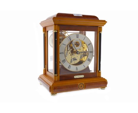 MODERN MANTEL CLOCK BY FRANZ HERMLE & SOHNserial number 352-070 SK, the four glass case enclosing a circular chapter ring wit