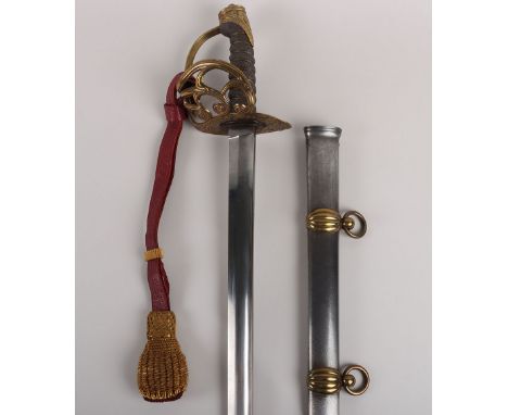 A scarce Victorian officer’s dress sword of the Royal Horse Guards, broad straight single edge blade 91cms, regulation brass 