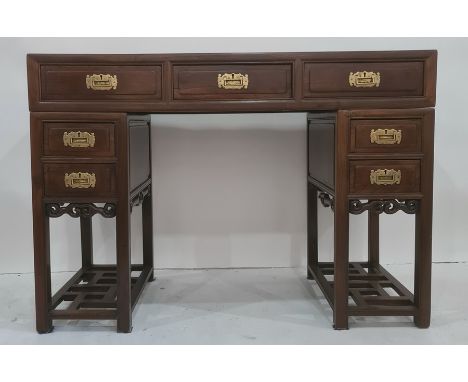 Chinese-style pedestal desk, the rectangular top above three drawers, each pedestal with two drawers and latticework shelf un