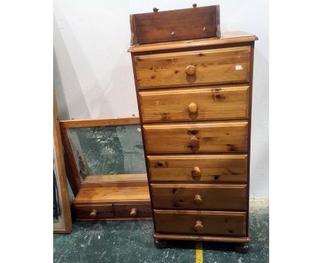 20th century narrow pine chest of six drawers, a dressing table mirror and a pine wall-hanging shelf (3) Condition ReportThe 