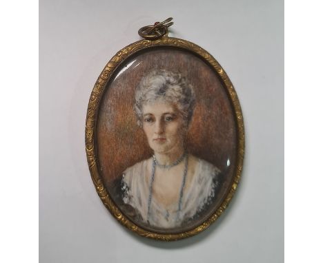 Late 19th / early 20th century schoolWatercolour miniature on ivoryHead and shoulders portrait of a lady with blue beads, gil
