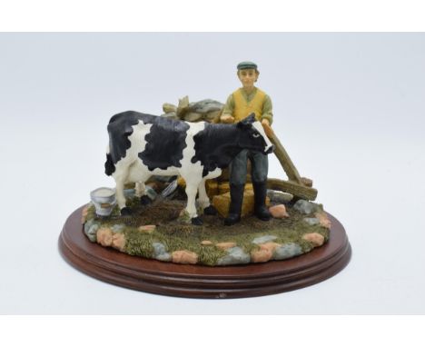 Boxed Regency Fine Arts tableau The Milking on wooden plinth. In good condition with no obvious restoration though there is d