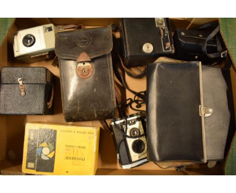 A collection of cameras and camera equipment to include a Houghton camera, various Kodak Brownies, Centon K100, Tamron 80-210