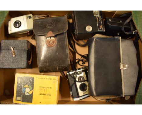 A collection of cameras and camera equipment to include a Houghton camera, various Kodak Brownies, Centon K100, Tamron 80-210