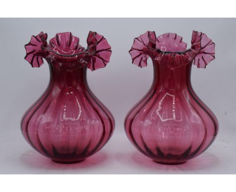 A pair of large vintage cranberry glass low-shouldered baluster vases with shaped rims (2). 28cm tall. In good condition with