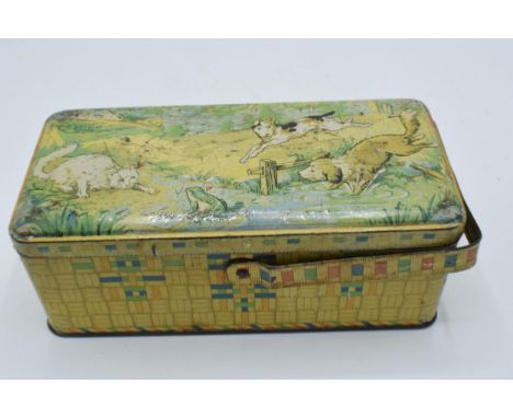 A vintage early to mid 20th century French tin depicting a animals playing. 19cm wide. 