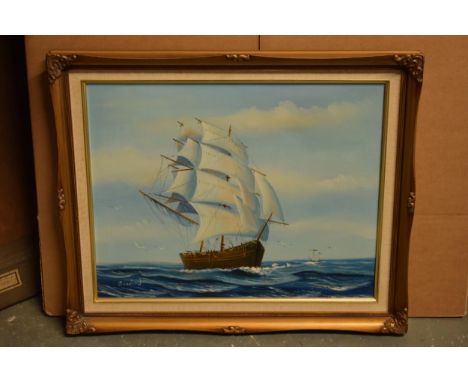 A 20th century oil on canvas style print depicting a sailing ship at sea bearing signature to bottom left in gilt-style frame