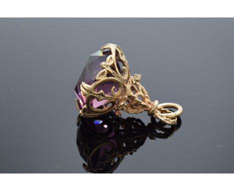 9ct gold ornate fob set with amethyst stone. 8.2 grams gross weight. 