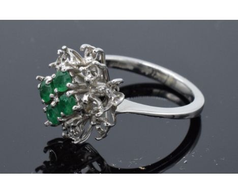 18ct white gold ladies ring set with semi-precious stones. 3.8 grams. Size K/L. There are missing stones from the outside of 