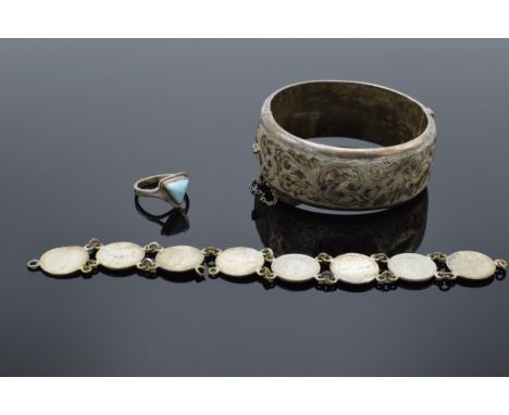 A collection of jewellery to include a hollow silver bangle, a silver ring and a silver 3-pence piece bracelet (41.3 grams ex