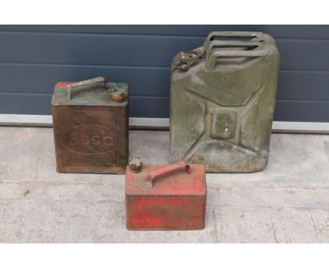 A trio of vintage fuel / oil cans to include an Esso example, one similar and a larger green jerry can (3). 