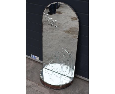 A large domed mirror with mirrored shelf with decoration to main panel. 98cm tall. 