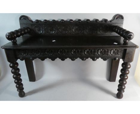A Carved Ebonised Oak Window Seat with Bobbin Front Legs and Arm Rests, 90cm Wide 