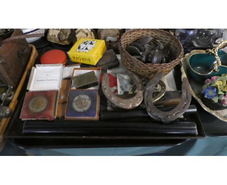 A Tray of Curios to Include Horse Shoe Kettle Stands, Bakelite Doorknobs, Roller Rules, Gardening Metals etc 