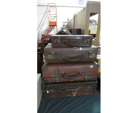 A Collection of Four Various Vintage Leather Suitcases 