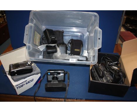 A boxed Olympus camera, a trip junior with Olympus lens, an Olympus trip MD3, a Kodak 155 x instamatic camera cased, a Pentax