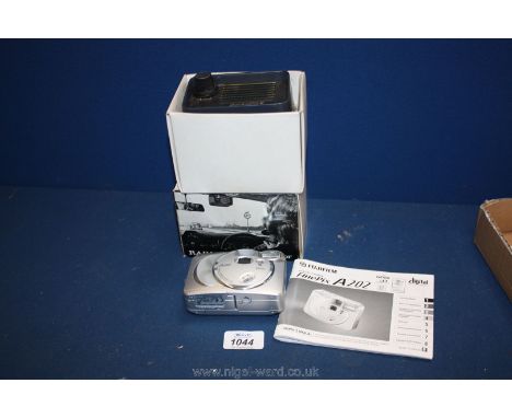 A Fujifilm A202 digital camera with instructions.