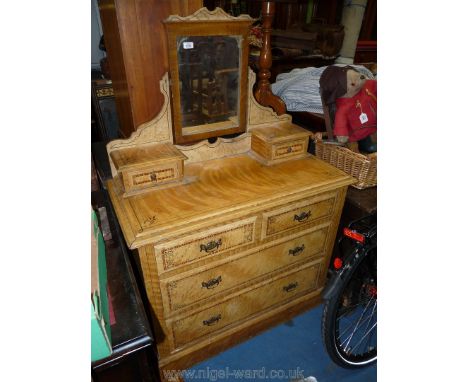 A stained Pine Dressing Chest with painted cross-banding and having two long and two short drawers and swing mirror over supp