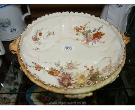 A large Royal Worcester, porcelain blush ivory Fruit Bowl, modelled in Rococo style with hand painted flowers and foliage on 