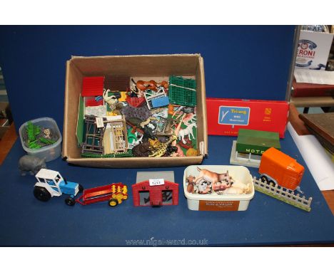 A large quantity of farm and zoo figures, buildings, tractor, etc, by Britains and others.