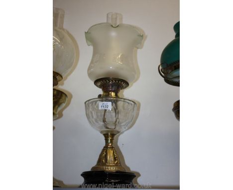 A clear glass Oil Lamp and blue lipped shade