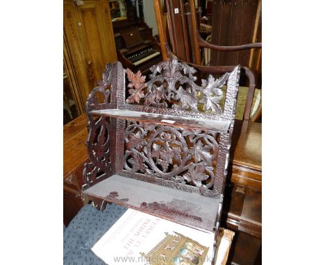 A wall hanging carved fretwork Oak arts and crafts folding Shelf Unit, slight damage, 17 1/2'' wide x 22'' high