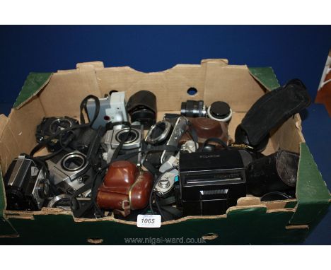A quantity of camera bodies to include Canon, Praktica, plus lenses.