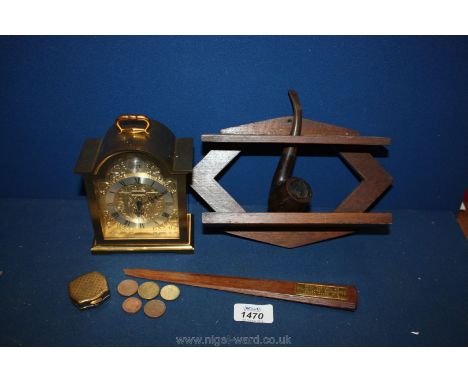 A Swiza "Tempus Fugit" carriage Clock, a wooden pipe rack and pipe, a piece of teak  from HMS Queen Elizabeth Dardanettes 191
