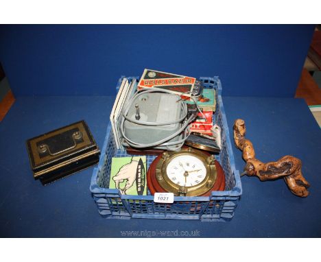 A quantity of miscellanea including four compacts, miscellaneous postcards, a quartz port hole clock, various games, dominoes