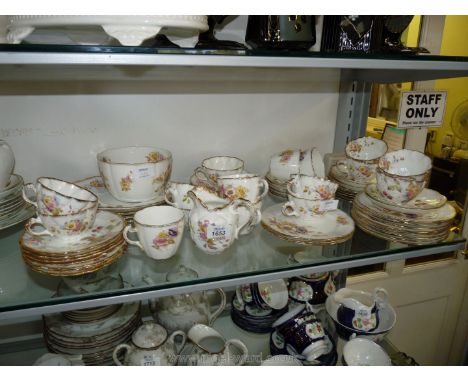 A W.H. & S. part Teaset including eleven saucers, twelve plates, two bread and butter plates, eleven cups, milk jug, sugar bo
