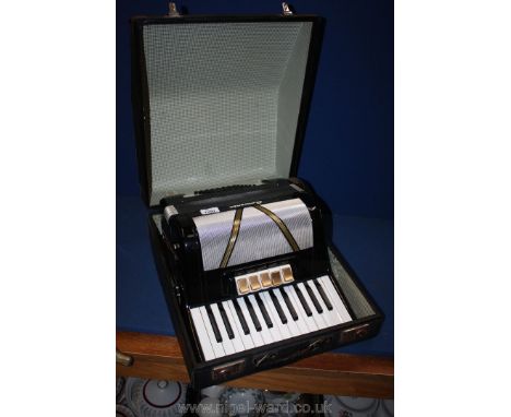 A Sorrento cased piano accordion.