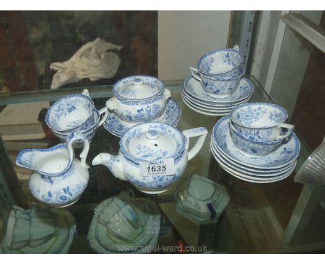 A Minton Dresden floral design blue and white Child's Teaset comprising two plates, ten saucers, six cups, teapot, sugar bowl