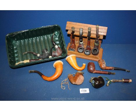 A quantity of old Pipes and a pipe rack.