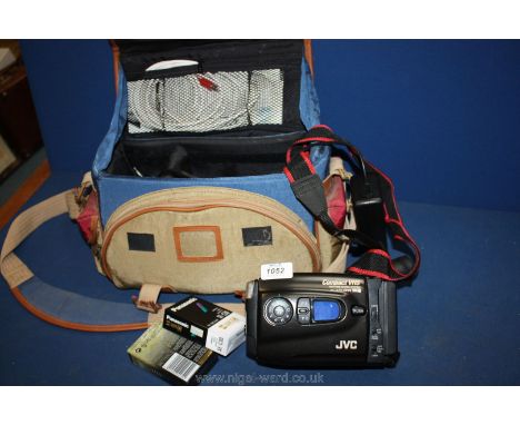 A cased JVC VHS camera, complete with charger and two unopened VHS cassettes.