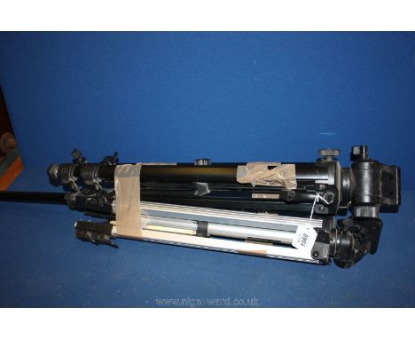 Two large camera tripods.