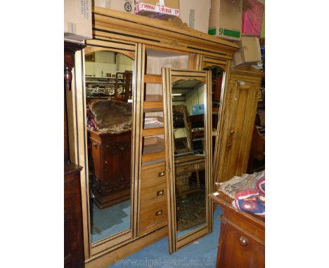 A fine old Edwardian light Ash Triple Wardrobe, having three mirrored doors, the left hand pair revealing a press cupboard in