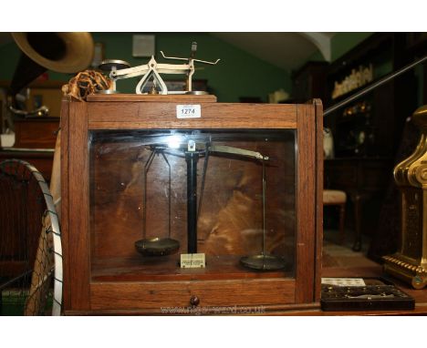 A set of Scales and weights in a wooden case with accessories