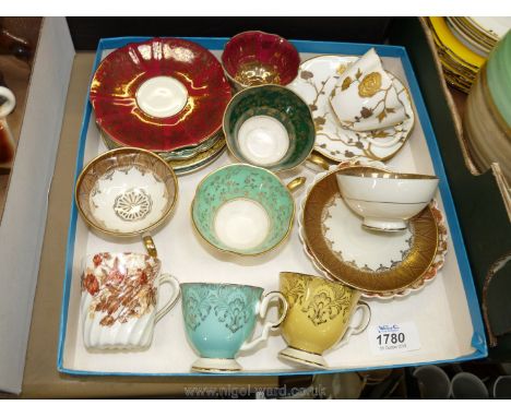 A quantity of highly decorative demitasse coffee Cups and saucers